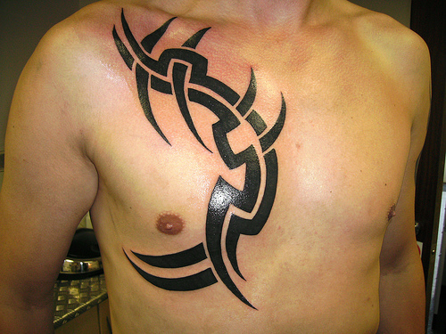 For men usually get tribal tattoos on their neck, back, shoulder blades 
