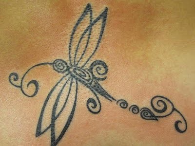 Dragonfly tattoo designs can easily be given a bold tribal look, 