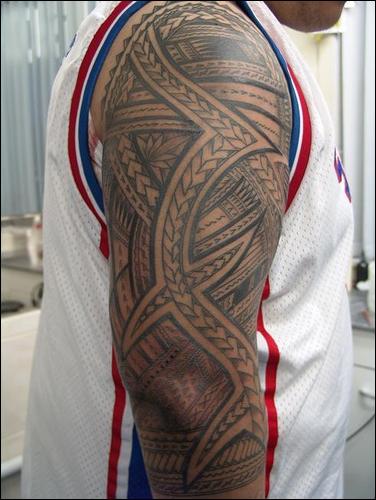Maori style lower back tattoo. Tribal tattoos design for men on arm with