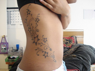 Stars are a very popular tattoo design. A star made as star tribal tattoos 